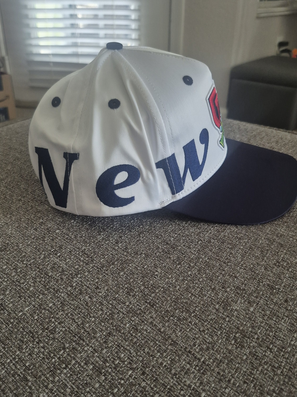White and Navy Men's Baseball Cap with 'New' Lettering